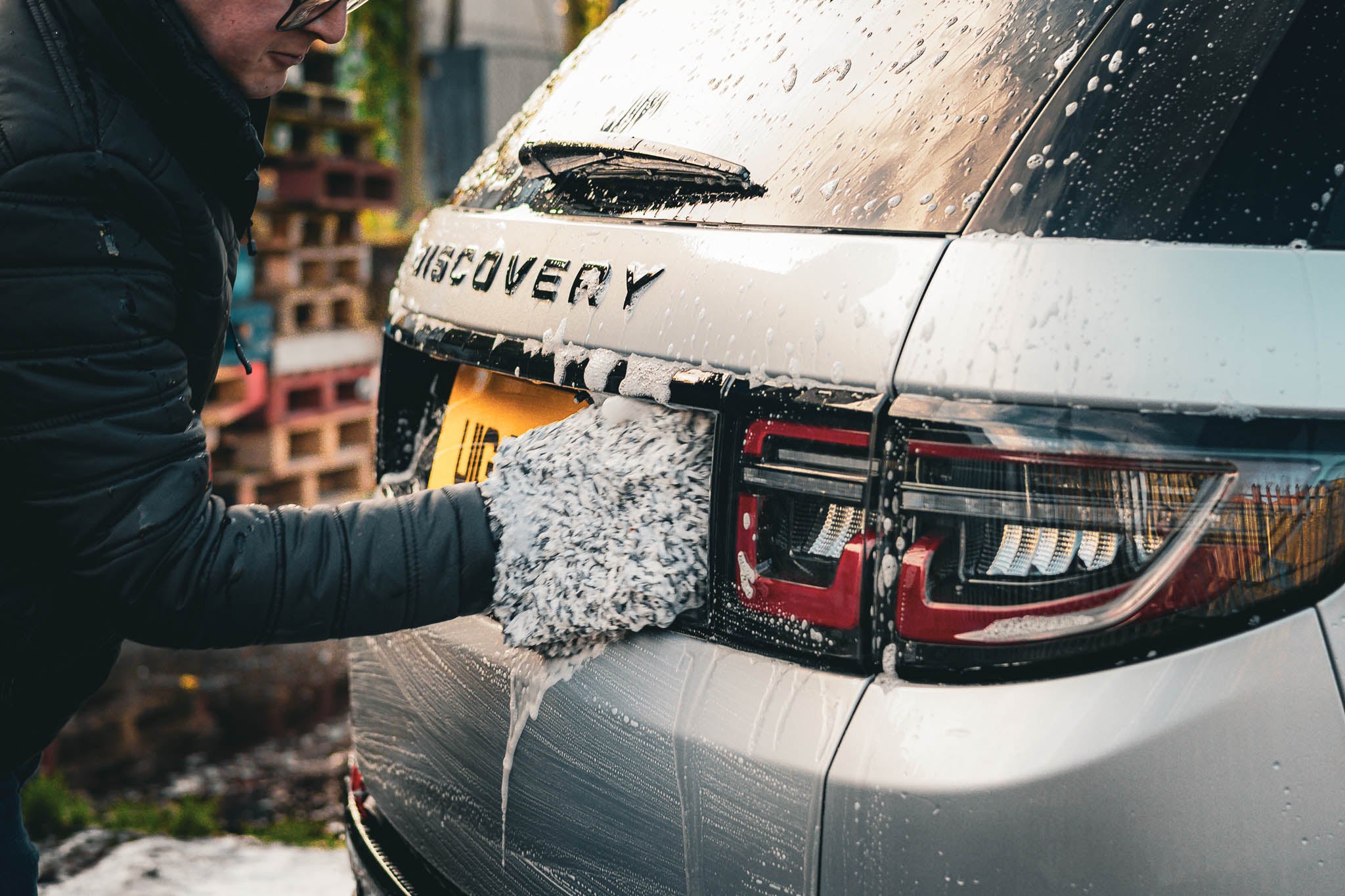 landrover discovery at a car wash with soap suds